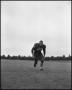 Photograph: [Football Player No. 68 Running on the Field, September 1962]