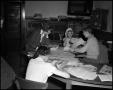 Photograph: [Students Working at Desk]