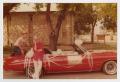 Photograph: [Two Men with a Red Convertible]