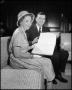 Thumbnail image of item number 1 in: '[Dr. Matthews and Mrs. Myrtle Hollander with Book]'.