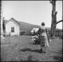 Photograph: [Woman at an outdoor quilting bee]