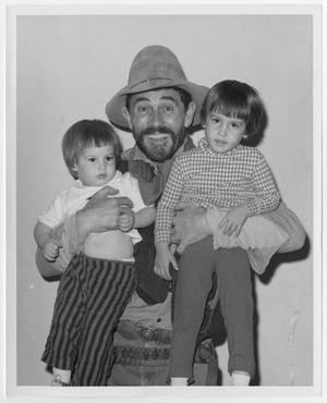 Primary view of object titled '[Ken Curtis with two children]'.