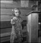 Photograph: [Young girl standing by podium]