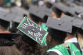 Photograph: [Decorated mortarboard at UNT Commencement]