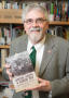 Primary view of [James Mueller with book]