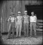 Photograph: [Pappy, Raymond and two others in front of a barn]