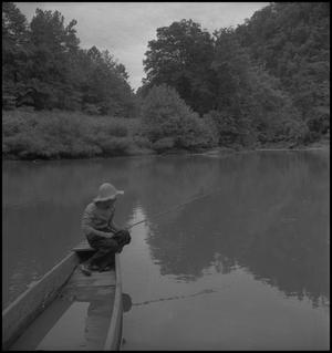Primary view of object titled '[Raymond fishing from a boat]'.