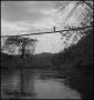 Primary view of [Woman crossing a bridge]