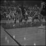 Photograph: [Blurry photo of a basketball game]
