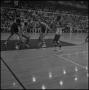 Photograph: [Blurry shot of a basketball game in progress]