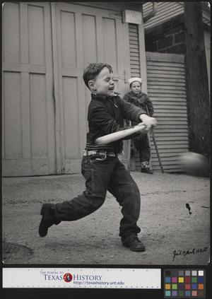 Primary view of object titled '[Junebug Clark Playing Baseball in an Alley]'.