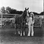 Photograph: [Woman in Animal Print with a Horse]