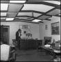 Photograph: [Rex Cauble and another man in an office]