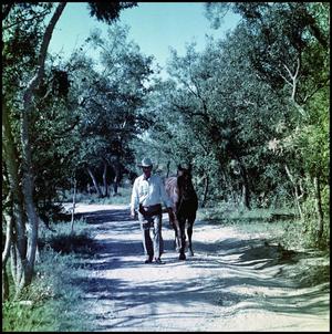 Primary view of object titled '[Marion Flynt with horse]'.