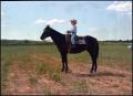 Photograph: [Child rides a horse]