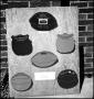 Photograph: [Photograph of sports awards mounted to plywood]