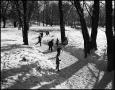 Photograph: [Children skating down an icy creek]
