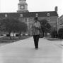 Photograph: [Woman in front of the Hurley Administration Building, 5]