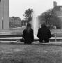 Photograph: [Two people sitting in front of Jody's Fountain, 4]