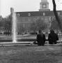 Photograph: [Two people sitting in front of Jody's Fountain, 3]