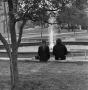 Photograph: [Two people sitting in front of Jody's Fountain, 2]