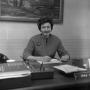 Photograph: [Dr. Irma Canton sitting behind her desk, 4]