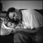 Photograph: [Joe Clark and Junebug on a couch, 4]