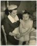 Photograph: [Mary Louise on her mothers lap]