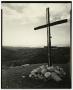 Photograph: [Photograph of a wooden cross atop a hill]