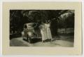 Photograph: [Consuelo and Julia Cuellar with large leaves]