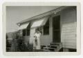 Photograph: [Julia Cuellar in front of house]