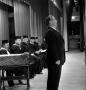 Photograph: [Man singing at commencement ceremony]