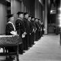 Photograph: [Faculty standing on stage during commencement 1961]