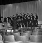 Photograph: [Choralettes rehearsing on stage]