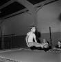 Photograph: [Child on trampoline in women's gym]