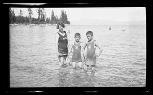 Primary view of object titled '[Irene, John, and Byrd Williams, III, standing in a lake]'.