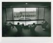 Photograph: [Students seated  in chairs by large window in A. M. Willis, Jr. Libr…