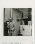 Photograph: [Photograph of man outside Chamber of commerce]