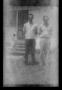 Photograph: [Byrd III and John Williams standing outside]
