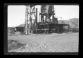 Primary view of [An oil derrick in the desert]