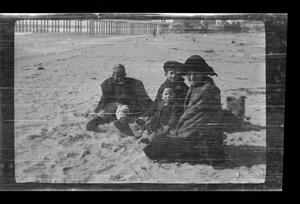 Primary view of object titled '[Byrd III, John, Charles, and Irene Williams at the beach]'.