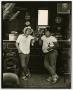 Photograph: [Photograph of two men standing by bar]