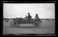 Thumbnail image of item number 1 in: '[Irene Biffle Williams with John and Byrd Williams, III, posing on the family car]'.
