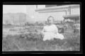 Photograph: [Baby Charles sitting in the grass]