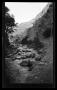 Photograph: [A road and river in a mountain landscape]