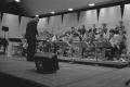 Thumbnail image of item number 1 in: '[Neil Slater Conducting the One O'Clock Lab Band]'.