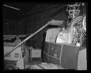 Primary view of object titled '[Mechanic working beside the H-40]'.