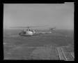 Photograph: [First flight of the XH-40 #3 over the Hurst plant]