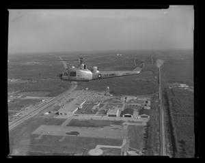 Primary view of object titled '[First flight of the XH-40 #3 over the Hurst plant]'.