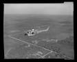 Photograph: [XH-40 #3 in flight over the Hurst plant]